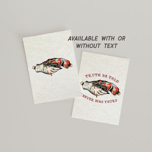 two identical printed materials, each with a hand-drawn illustration and text. The text on the materials reads "TRUTH BE FOLD" and "NEVER WAS YOURS".