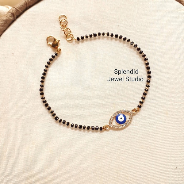 evil eye mangalsutra bracelet, mangalsutra bracelet with evil eye, evil eye hand mangalsutra, mangalsutra bracelet, mangalsutra hand chain