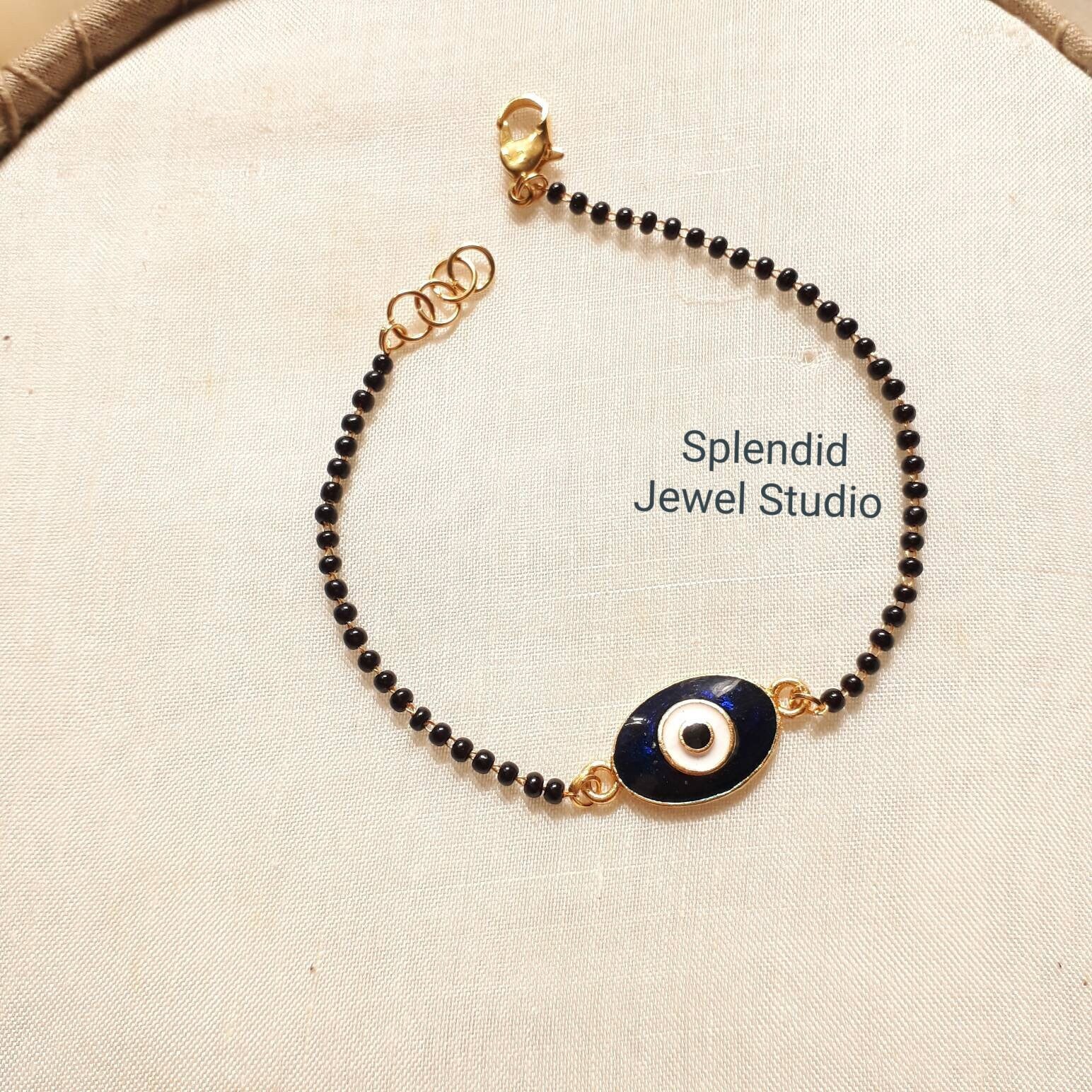 Pin by Jharna Ahuja on bracelets | Gold bracelet for girl, Evil eye  necklace gold, Black beads mangalsutra design