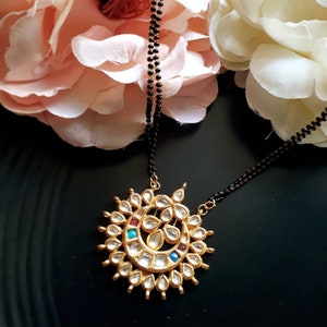 May include: A set of three ceramic vases in varying heights. The vases are white with a textured, ridged design. The tallest vase is approximately 10 inches tall, the medium vase is 8 inches, and the smallest is 6 inches.