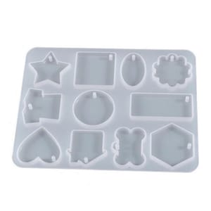 May include: A white silicone mold with 10 different shapes for making resin pendants. The shapes include a star, square, oval, circle, rectangle, heart, arrow, bone, and hexagon.