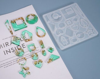 May include: A clear silicone mold with 16 different shapes for making earrings. The mold is shown with finished earrings in green resin with gold flakes.