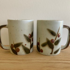 1970s speckled pottery mugs with berry design set of 2