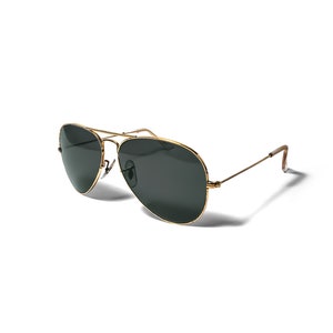 May include: Gold aviator sunglasses with dark green lenses.