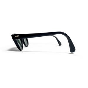 May include: Black sunglasses with a classic design. The frames are thick and angular, with a small silver accent on the temples. The lenses are dark, and the arms curve down to fit over the ears. A stylish accessory.