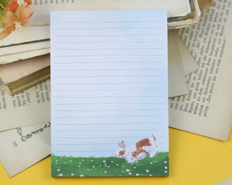 Notepad - Rabbits in a flower meadow - Spring - Lined - A6 - 50 pages