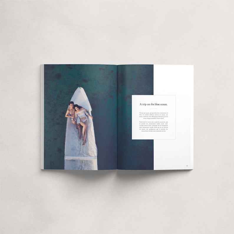 May include: A couple lies in a white boat on a turquoise blue ocean. The text "A trip on the blue ocean." is on the right side of the page.