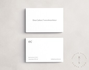 May include: White business card with the text "Elena Carlson // www.elenacarlson.co" and "ec" on the front. The back of the card has the text "Jantorasstreet 140-A Amsterdam 9999 AP" and "hello@elenacarlson.com". A circular logo with the text "PREMIUM DESIGNS RUBEN STOM" and "R-S" in the center is also on the back of the card.