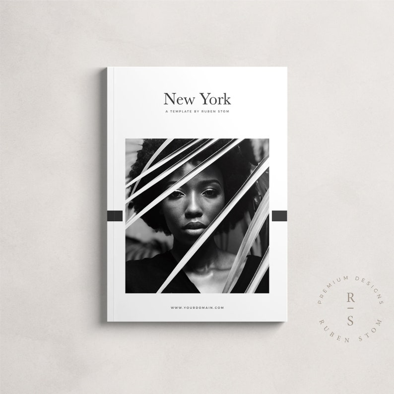 May include: Black and white photograph of a woman's face against a black background. The woman is looking at the camera. The photo is framed by a black border. The text "New York" is at the top of the page. The text "A Template by Ruben Stom" is below the title. The text "www.yourdomain.com" is at the bottom of the page. The text "Premium Designs" is in a circle with the text "Ruben Stom" below it.