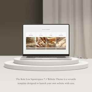 May include: A laptop computer displaying a website with a minimalist design. The website features a shop by collection section with images of jewelry, including bracelets, earrings, rings, and necklaces.