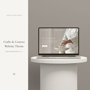 May include: A laptop computer displaying a website for crafts and courses. The website has a light background with a photo of a person's hands working with clay. The text on the website reads "Crafts & Courses" and "New Course Out Now".
