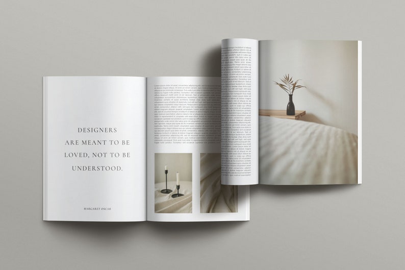 May include: Open magazine with a quote about designers being loved, not understood. The quote is attributed to Margaret Olsen. The magazine features a photo of two black candlesticks on a white surface and a photo of a vase with dried branches on a white bedspread.