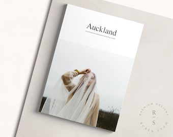May include: A white magazine cover with the title "Auckland" and the text "A professional multipurpose branding bundle". The cover features a photo of a person wearing a white veil and a brown jacket.
