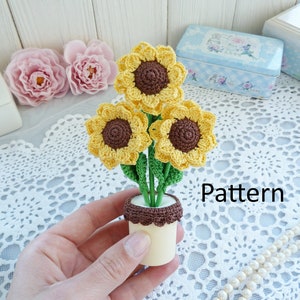 かぎ針編みの鉢植えのひまわりのパターン。ウクライナのひまわり。ひまわりのパターン。かぎ針編みの花のモチーフ。かぎ針編みのギフト。かぎ針編みの母の日