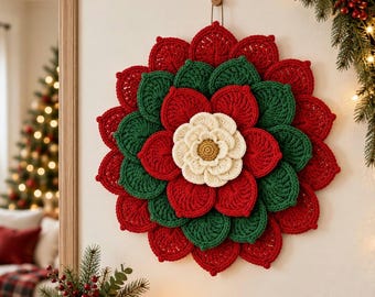 May include: A circular wall hanging featuring layered crochet petals in alternating red and dark green colors, centered with a smaller cream-colored flower with a textured golden-brown center, suspended by a simple loop from a small wooden peg.