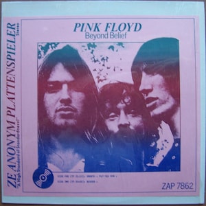 May include: A Pink Floyd album cover featuring a group of men with long hair. The album title "Beyond Belief" is in blue text. The album cover also includes the text "ZE ANONYM PLATTENSPIELER" and "A High Standard of Standardness!"