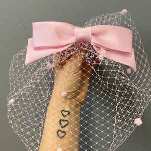 Pink satin bow birdcage veil