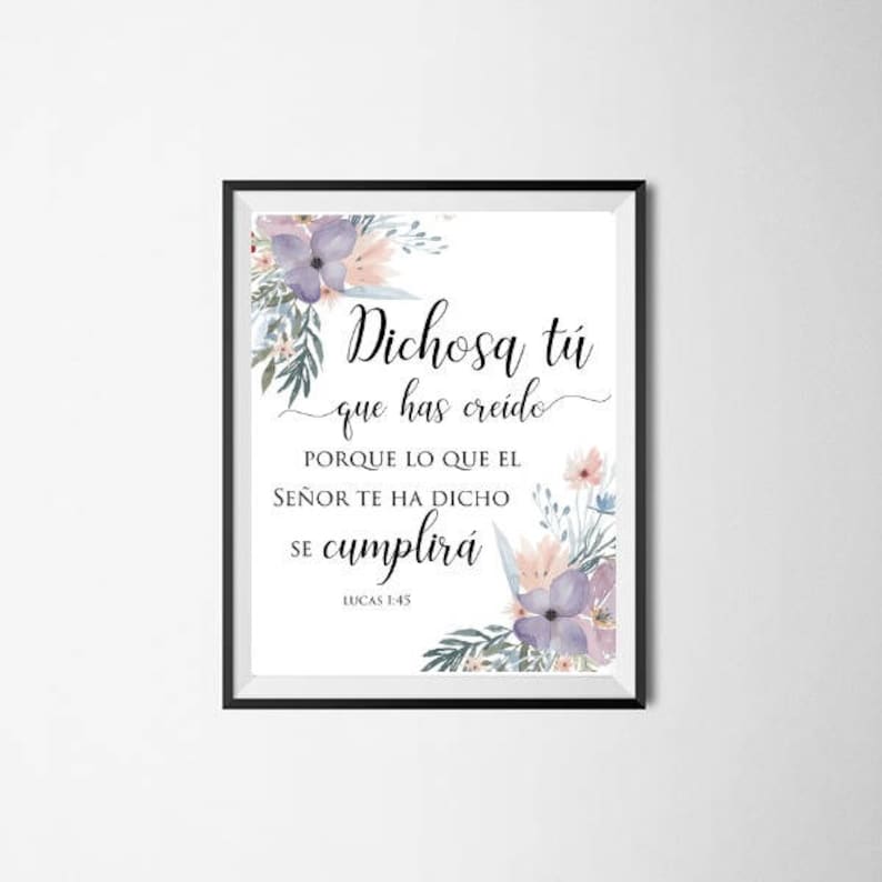 May include: Framed art print with the text "Dichosa t&uacute; que has cre&iacute;do" in elegant script, accented by watercolor floral arrangements in purple, pink, and green. The print includes the Bible verse from Luke 1:45.