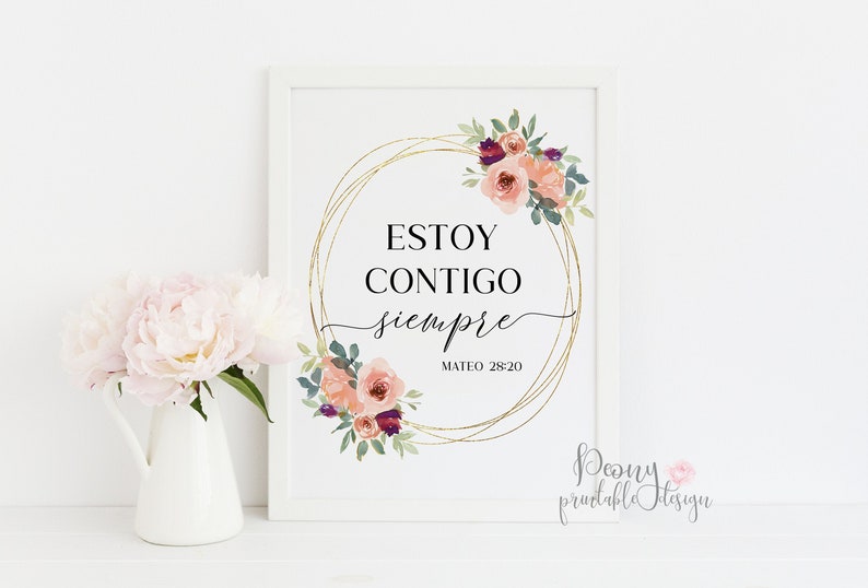 May include: A white framed print with a gold floral wreath and the Spanish text "Estoy contigo siempre" (I am with you always) with the scripture reference "Mateo 28:20".