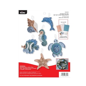 May include: A set of six felt ornaments to be decorated with sequins and beads. The ornaments are shaped like a seashell, a dolphin, a seahorse, a fish, a turtle, and a starfish. The kit includes stamped felt, cotton floss, sequins, beads, needles, and instructions.