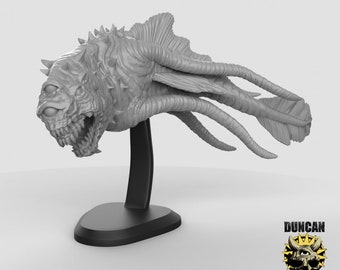 May include: A gray, detailed, 3D printed model of a monstrous, multi-eyed, spiky creature with tentacles and fins. The creature is mounted on a black base. The text "Duncan Shadow" is visible in the lower right corner of the image.