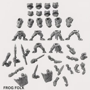 Op de afbeelding: Een set van 3D-geprinte plastic miniaturen voor tabletop role-playing games, die kikkerachtige wezens voorstellen. De set bevat verschillende lichaamsdelen, waaronder hoofden, torso's, benen en armen, waardoor de figuren kunnen worden aangepast. De miniaturen zijn ongeverfd en klaar om te worden geassembleerd en geschilderd.