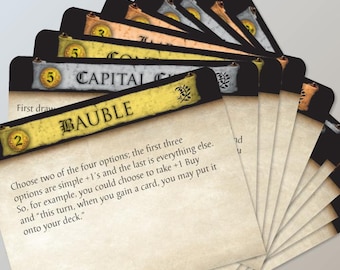 May include: A close-up of a set of game cards with a parchment-like background. The top card features the text "Capital City" and "Bauble". The card text reads "Choose two of the four options; the first three options are simple +1's and the last is everything else. So, for example, you could choose to take +1 Buy and "this turn, when you gain a card, you may put it onto your deck."