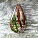 see more listings in the resin plant necklaces section