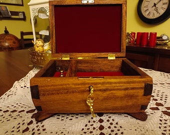 Handmade solid okumè wood jewelery box with secret compartment