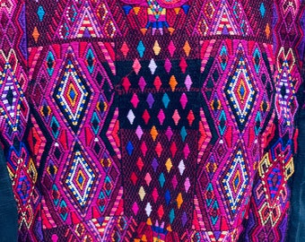 Vintage huipil from Chichi in  a rich berries (burgundy , fucsia , turquesa ) hand weaved on a backstrap loom. Boho style