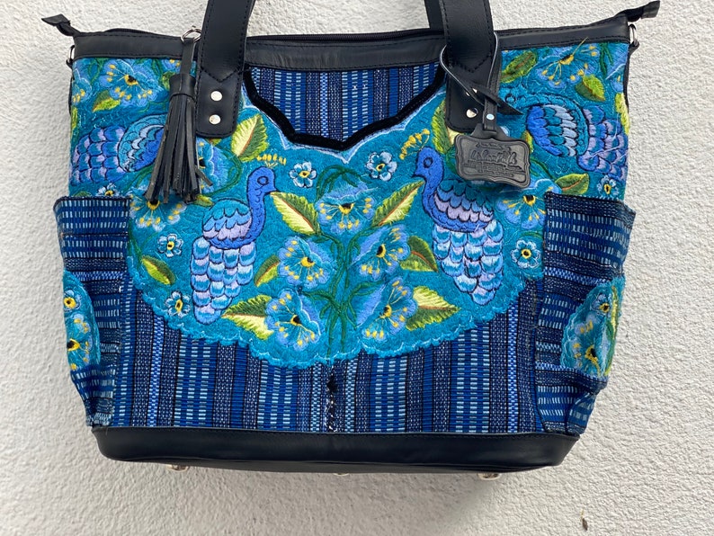 huipil on both sides Sale save 25 dollars !Convertible bag turns into backpack Sits on its own