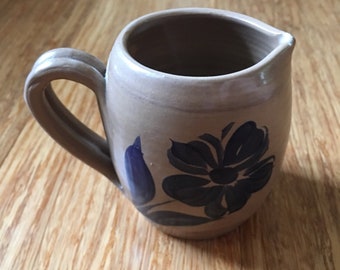Small Pottery Pitcher with Handle and Blue Flower