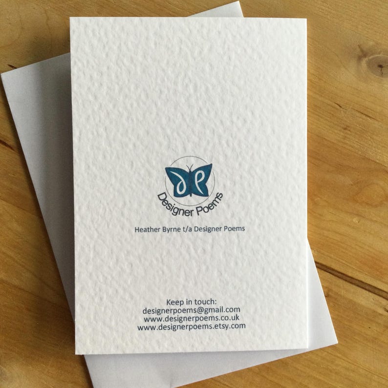 May include: A white textured greeting card with a blue butterfly logo that says "Designer Poems". The card is inside a white envelope. The text "Heather Byrne t/a Designer Poems" is below the logo. Contact details are also included.