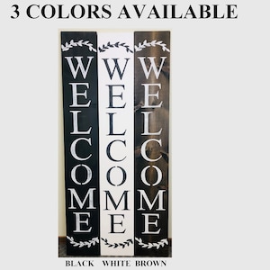 3 colors of welcome sign available. Black, White, and Brown. Roman Font, with wreath accent at top and bottom.