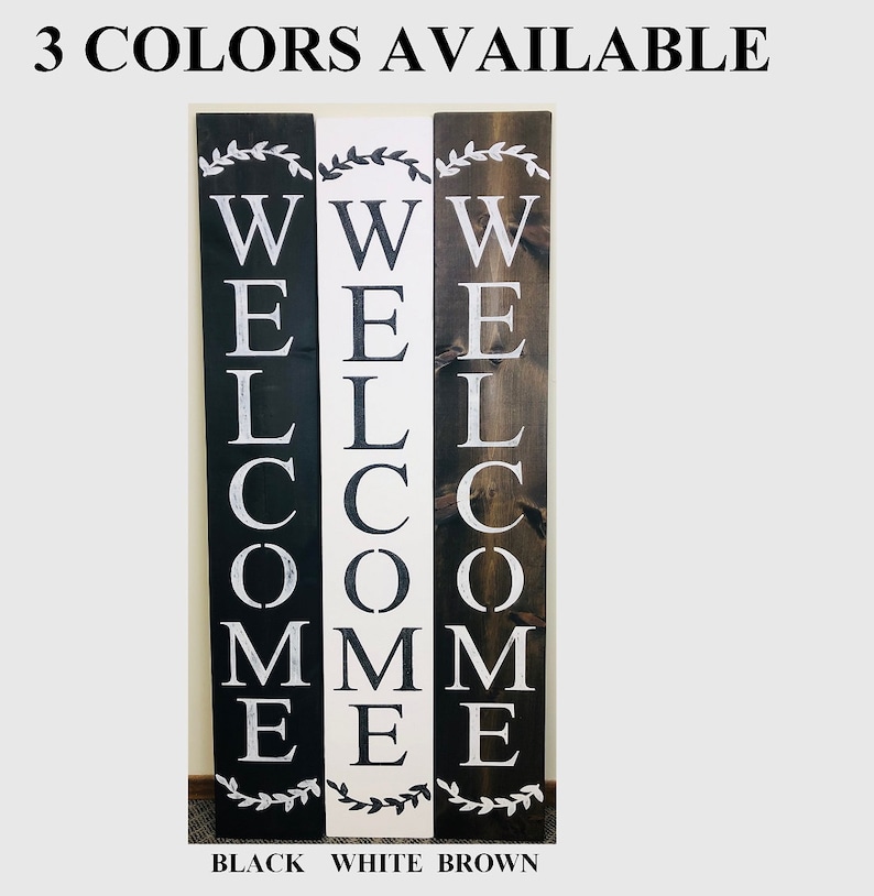 3 colors of welcome sign available. Black, White, and Brown. Roman Font, with wreath accent at top and bottom.