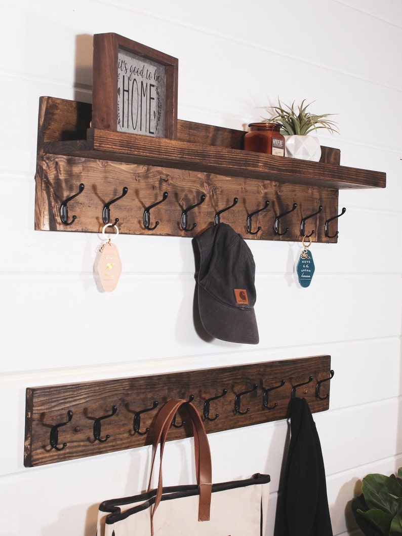 Brown coat rack, with shelf for pictures and keys and with hooks for coats, hats, leashes and keys