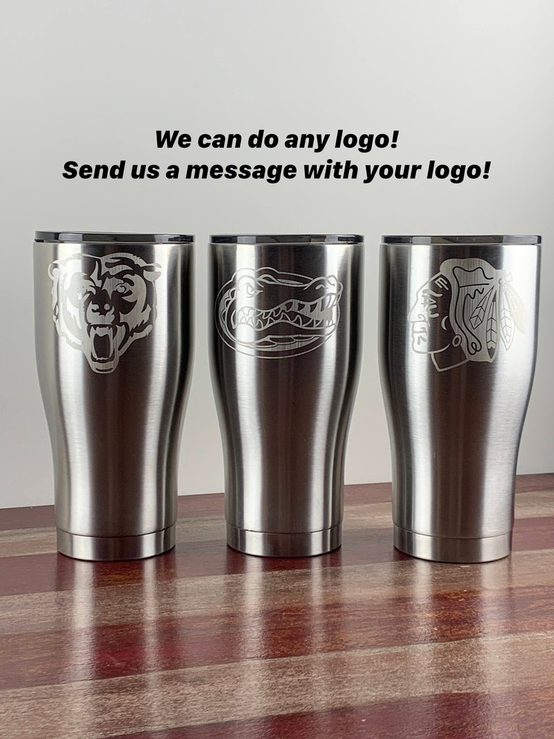 May include: Three stainless steel tumblers with different logos engraved on them. The logos are a bear, an alligator, and a hockey team logo. The text "We can do any logo! Send us a message with your logo!" is visible at the top of the image.
