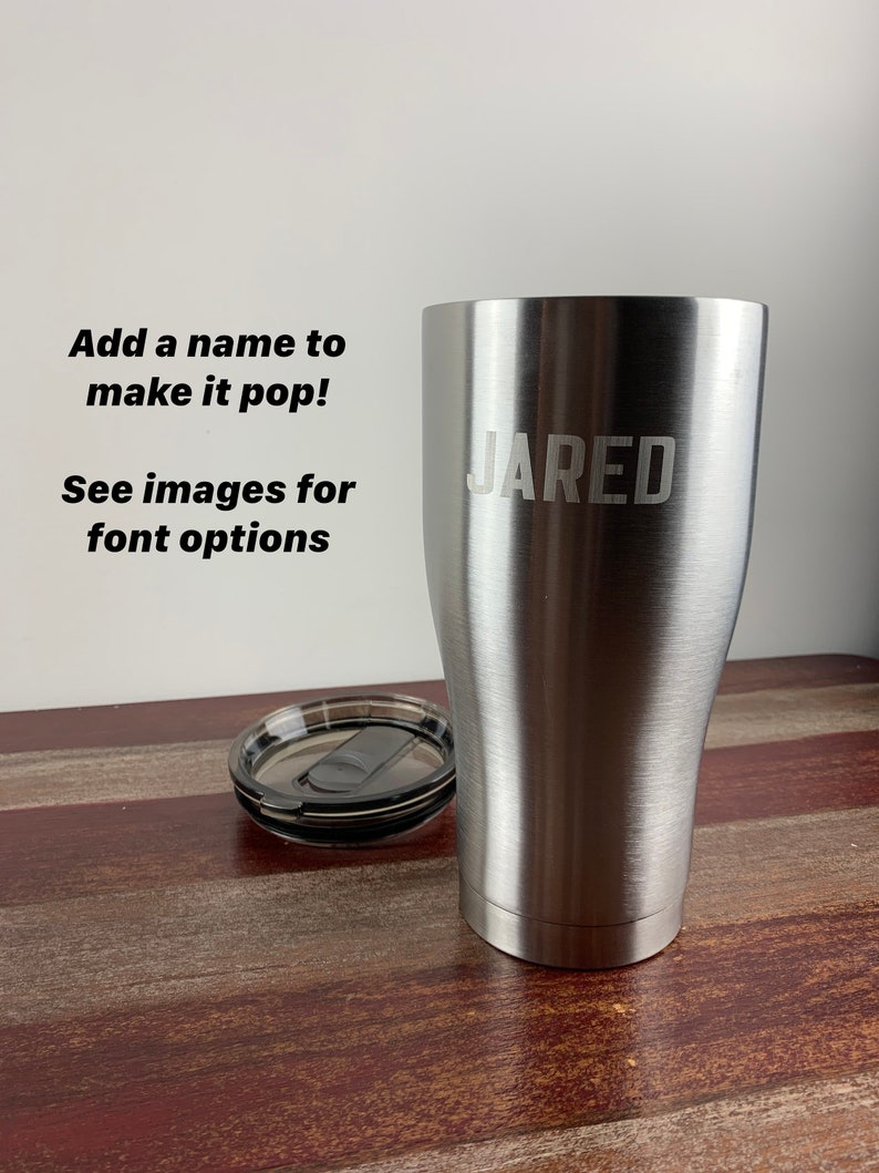May include: A stainless steel tumbler with a lid. The tumbler has the name "JARED" engraved on the side.