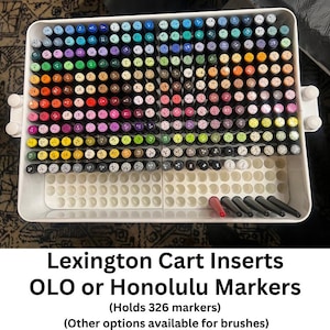 May include: A white organizer tray filled with a variety of colorful markers. The markers are arranged in rows by color, including shades of red, orange, yellow, green, blue, purple, and brown. Text on the image reads "Lexington Cart Inserts OLO or Honolulu Markers (Holds 326 markers)".
