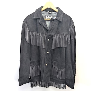 May include: Black suede jacket with fringe detailing. The jacket has a collared neckline, button-up front, and pockets. The brand name "Schott" is visible on the label. The fringe is along the sleeves, pockets, and the bottom hem.