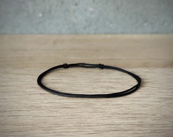 SCHWARZes wasserdichtes dünnes Schlupfknoten-Kordelarmband Glücksschmuck Mann Frau Rock minimalistisch buddhistisch