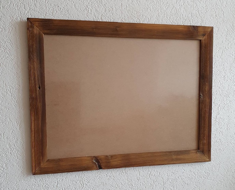 May include: A rustic wooden picture frame with a brown finish. The frame is empty and ready to display a photo or artwork.