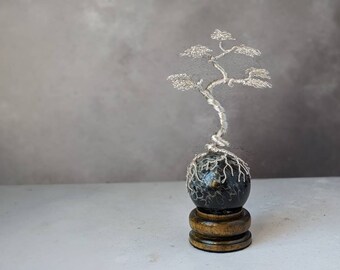 Silver plated copper wire tree on a palm root sphere with a glossy dark wooden sphere holder