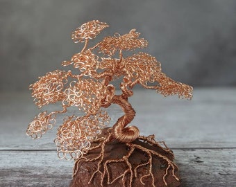 Copper wire tree on a raw tiger eye base