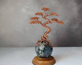 Copper wire tree on a moss agate sphere with a natural wooden base