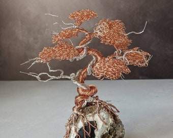 Merlinite with a copper and silver plated copper wire tree sculpture