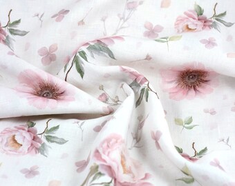 May include: White linen fabric with a delicate floral pattern featuring pink flowers and green leaves.