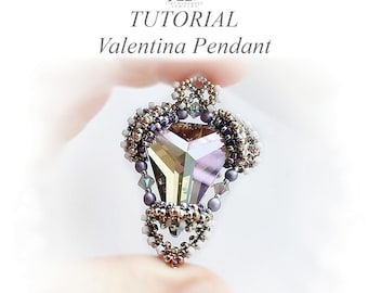 May include: A handmade Valentina Pendant tutorial. The pendant features a large, faceted, multi-colored crystal at its center, surrounded by intricate beadwork in shades of purple, gold, and silver. The text "TUTORIAL Valentina Pendant" is at the top.