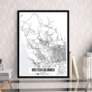 May include: A framed black and white map print of British Columbia, Canada. The map features a detailed network of roads and geographical features. The text "BRITISH COLUMBIA CANADA" is displayed at the bottom of the print.