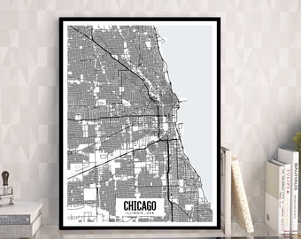 May include: Black and white framed map of Chicago, Illinois, USA. The map shows the city's street grid and Lake Michigan. The word "Chicago" is printed in a white rectangle at the bottom of the map.